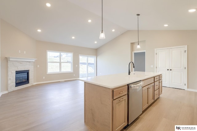 12206 S 113th St, Papillion, NE 68046 - kitchen with dishwasher, lofted ceiling, light wood-type flooring, a center island with sink, and hanging light fixtures