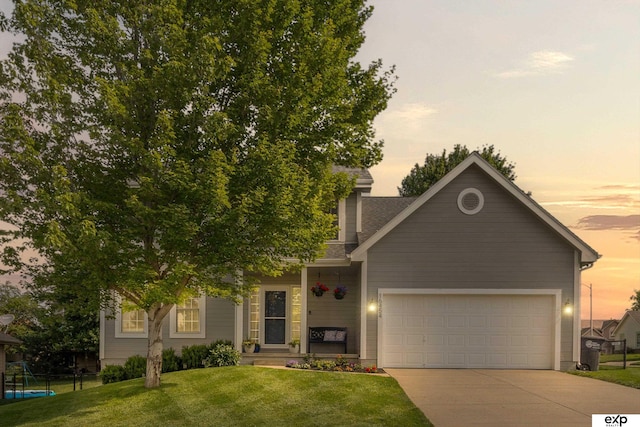 16454 Drexel St, Omaha, NE 68135 - view of front of house featuring driveway, a lawn, a garage, and a porch