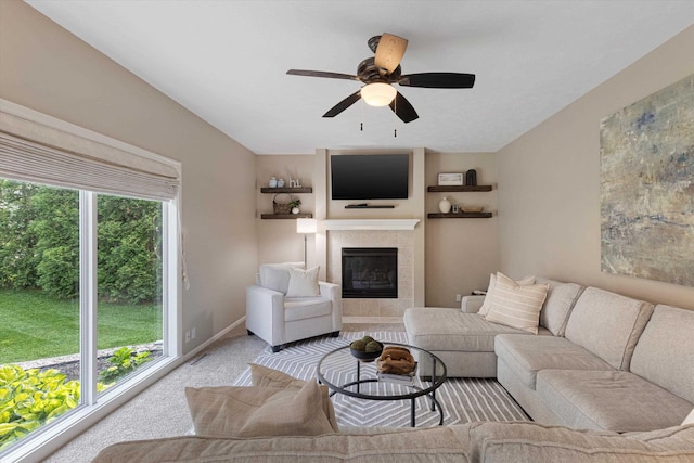 16454 Drexel St, Omaha, NE 68135 - carpeted living room with a tiled fireplace and a ceiling fan