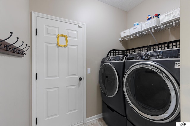 16454 Drexel St, Omaha, NE 68135 - laundry room with washing machine and dryer and baseboards