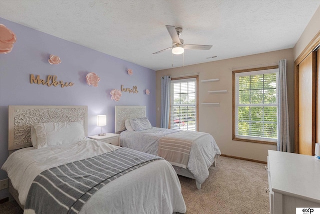 16454 Drexel St, Omaha, NE 68135 - bedroom featuring light carpet, ceiling fan, a textured ceiling, and a closet