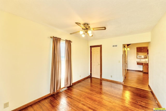 1916 S 42nd Rd, Talmage, NE 68448 - unfurnished room with light wood-style floors and ceiling fan