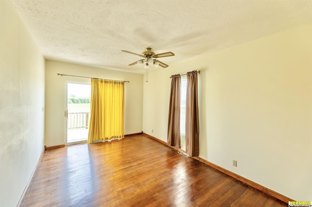 1916 S 42nd Rd, Talmage, NE 68448 - empty room featuring a ceiling fan, hardwood / wood-style flooring, and a textured ceiling