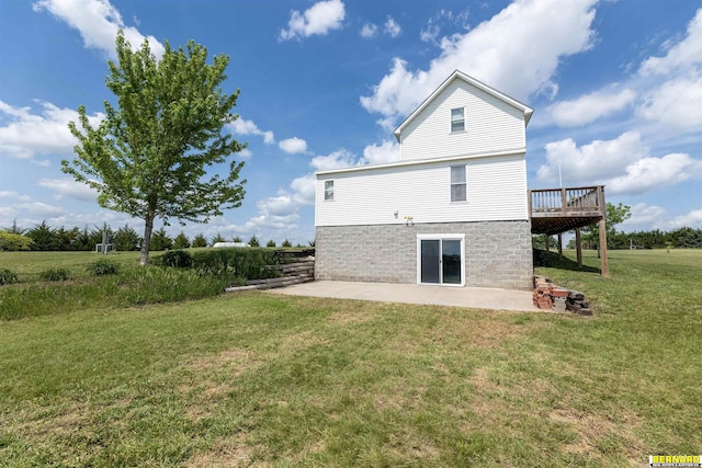 1916 S 42nd Rd, Talmage, NE 68448 - rear view of property with a patio, a wooden deck, and a lawn