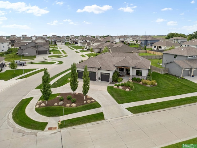 4802 N 187th Ave, Elkhorn, NE 68022 - view of front of house featuring a residential view, curved driveway, a garage, and a front yard