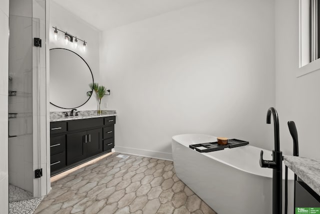 4802 N 187th Ave, Elkhorn, NE 68022 - bathroom with vanity, a soaking tub, and tiled shower