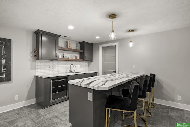 4802 N 187th Ave, Elkhorn, NE 68022 - kitchen with beverage cooler, open shelves, backsplash, a peninsula, and light stone countertops