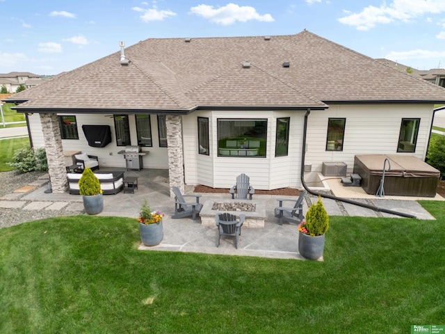 4802 N 187th Ave, Elkhorn, NE 68022 - back of property featuring a hot tub, roof with shingles, a patio area, and a lawn