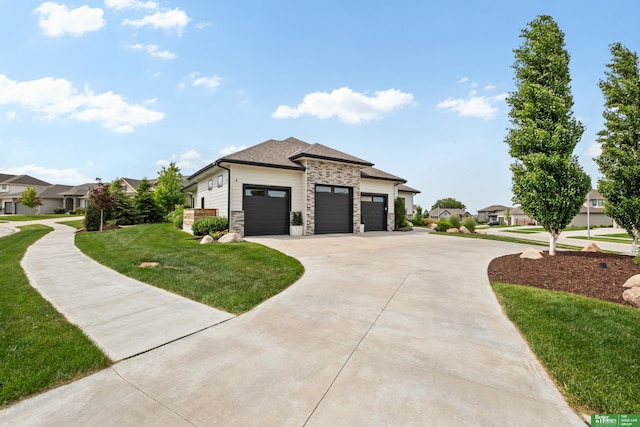 4802 N 187th Ave, Elkhorn, NE 68022 - view of front of house with stone siding, driveway, a front yard, an attached garage, and a residential view