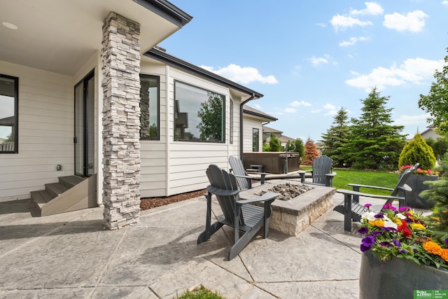 4802 N 187th Ave, Elkhorn, NE 68022 - view of patio / terrace with an outdoor fire pit and a hot tub