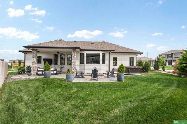 4802 N 187th Ave, Elkhorn, NE 68022 - rear view of house with a hot tub, a patio, a ceiling fan, and a shingled roof