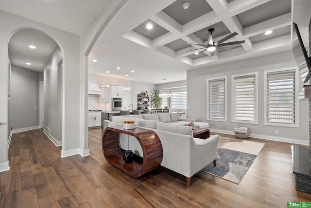4802 N 187th Ave, Elkhorn, NE 68022 - living room featuring a ceiling fan, dark wood finished floors, recessed lighting, arched walkways, and beam ceiling
