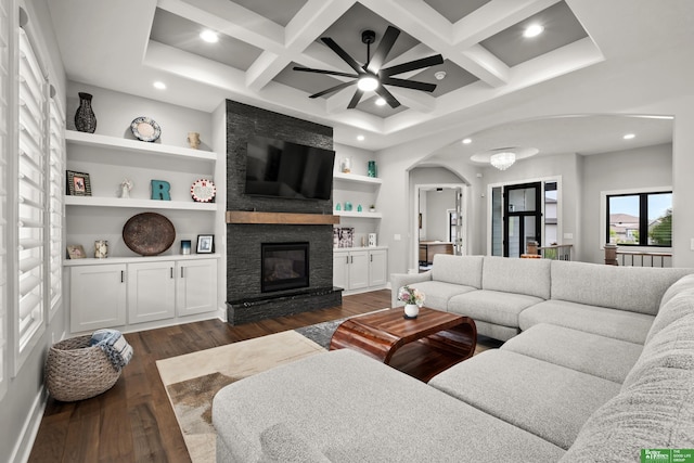 4802 N 187th Ave, Elkhorn, NE 68022 - living area with arched walkways, coffered ceiling, dark wood-style flooring, a fireplace, and recessed lighting