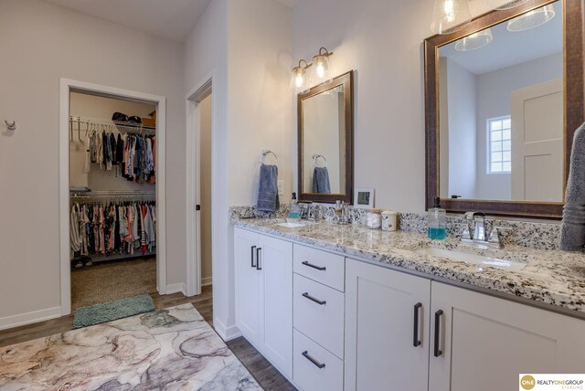 12618 Glenn St, Omaha, NE 68138 - full bath featuring double vanity, wood finished floors, and a spacious closet