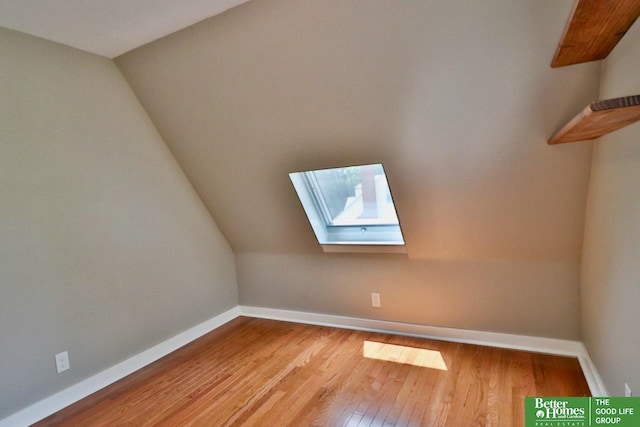 1115 S 63rd St, Omaha, NE 68106 - bonus room with a skylight, hardwood / wood-style floors, and vaulted ceiling