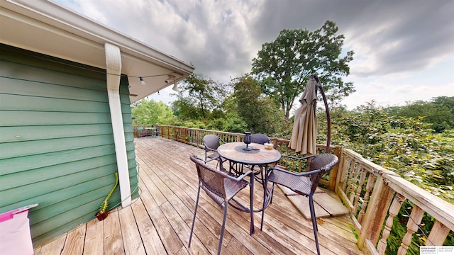 7923 Harney St, Omaha, NE 68114 - wooden deck featuring outdoor dining area