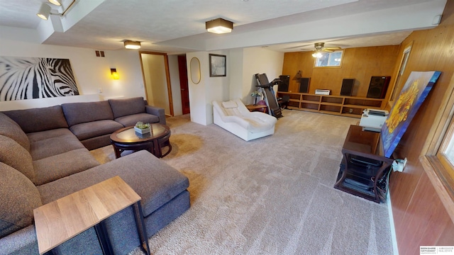 7923 Harney St, Omaha, NE 68114 - living room with wooden walls, carpet floors, and a ceiling fan
