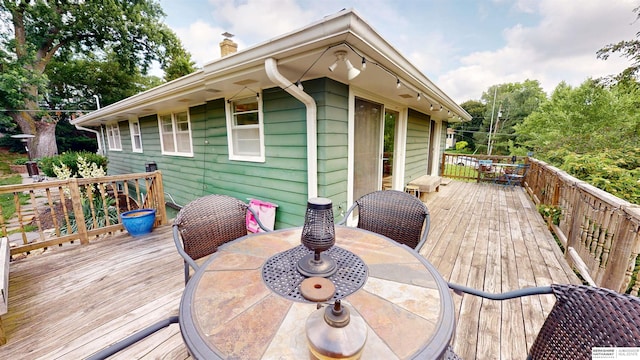 7923 Harney St, Omaha, NE 68114 - wooden deck with outdoor dining area