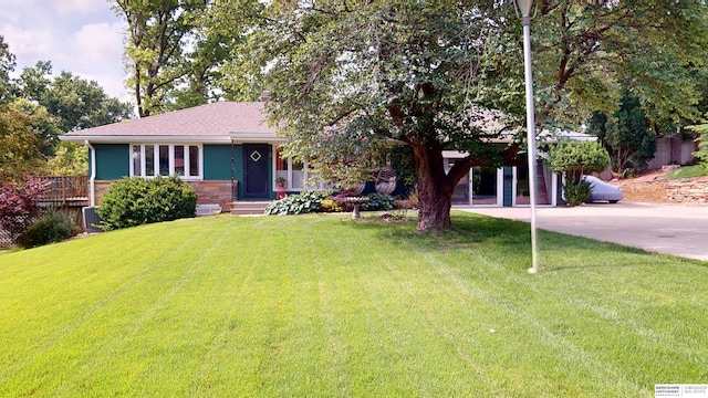7923 Harney St, Omaha, NE 68114 - view of front of house featuring a front yard and concrete driveway