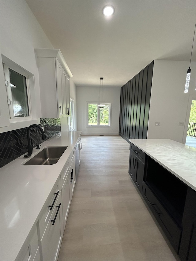 19756 Briar St, Gretna, NE 68028 - kitchen with light countertops, hanging light fixtures, white cabinetry, tasteful backsplash, and recessed lighting