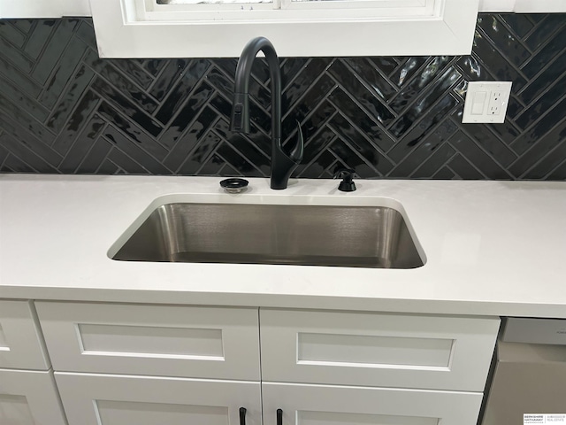 19756 Briar St, Gretna, NE 68028 - kitchen view of decorative backsplash, light countertops, and white cabinetry