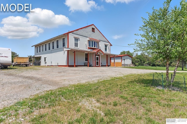 9404 N 294th St, Valley, NE 68064 - view of front of home with driveway, a porch, and a front lawn