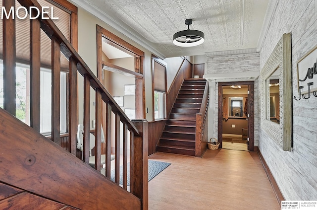 9404 N 294th St, Valley, NE 68064 - staircase featuring an ornate ceiling, healthy amount of natural light, crown molding, and wood finished floors