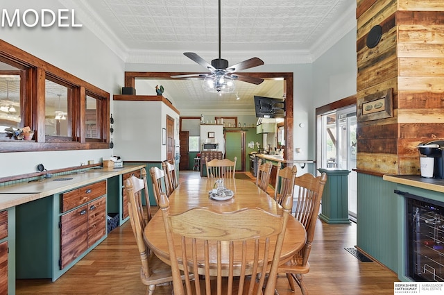 9404 N 294th St, Valley, NE 68064 - dining room with beverage cooler, light wood-style flooring, an ornate ceiling, ornamental molding, and ceiling fan