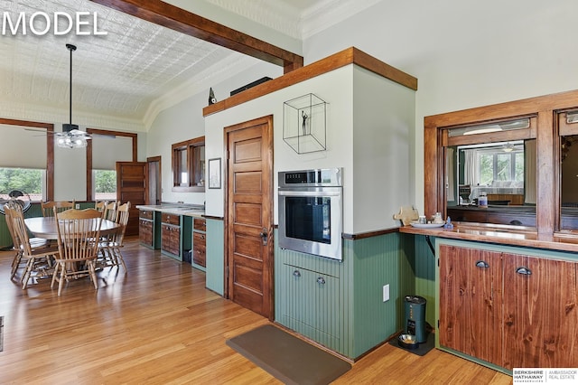 9404 N 294th St, Valley, NE 68064 - kitchen with oven, light wood finished floors, plenty of natural light, a wainscoted wall, and ceiling fan