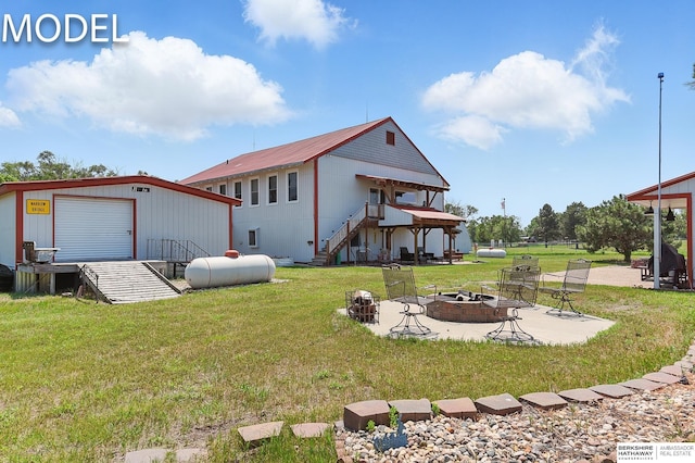 9404 N 294th St, Valley, NE 68064 - rear view of property featuring an outdoor fire pit, a lawn, stairway, an outbuilding, and a wooden deck