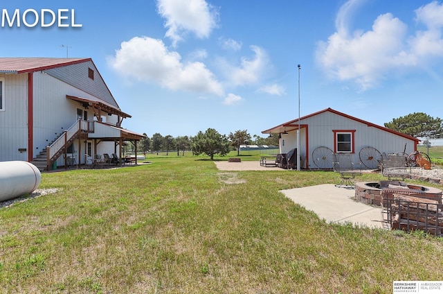 9404 N 294th St, Valley, NE 68064 - view of green lawn with an outdoor fire pit, stairs, a wooden deck, and a patio area