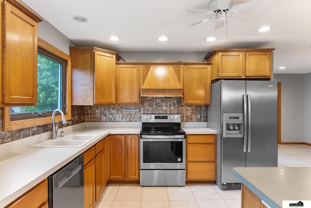 9521 N 140th St, Waverly, NE 68462 - kitchen with stainless steel appliances, premium range hood, tasteful backsplash, ceiling fan, and light countertops