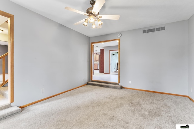 9521 N 140th St, Waverly, NE 68462 - carpeted spare room with stairway, a ceiling fan, and a smoke detector