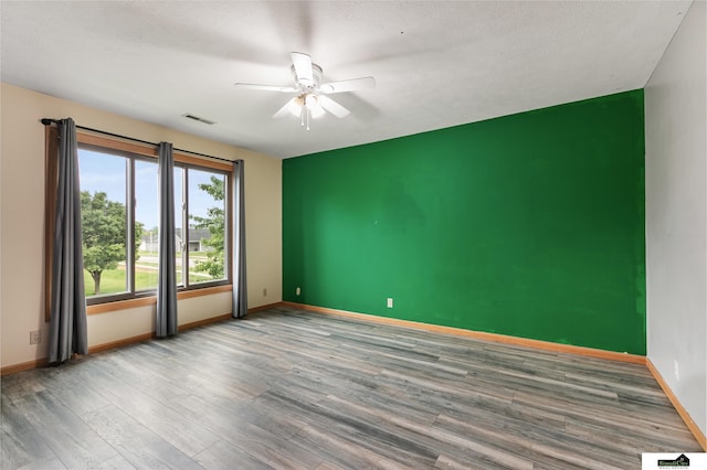 9521 N 140th St, Waverly, NE 68462 - spare room featuring a ceiling fan and wood finished floors