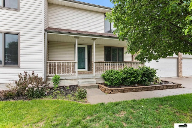 9521 N 140th St, Waverly, NE 68462 - view of front of home featuring covered porch, concrete driveway, and a garage