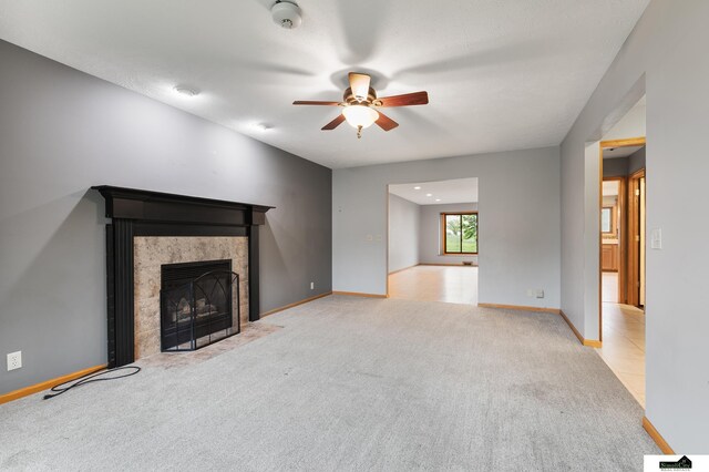 9521 N 140th St, Waverly, NE 68462 - unfurnished living room with a ceiling fan, light colored carpet, and a tiled fireplace