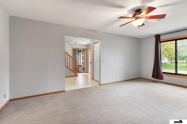9521 N 140th St, Waverly, NE 68462 - empty room with light carpet, a ceiling fan, and stairs