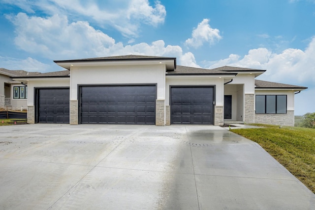 10110 Laramie St, Papillion, NE 68046 - prairie-style home with an attached garage, driveway, stone siding, and stucco siding