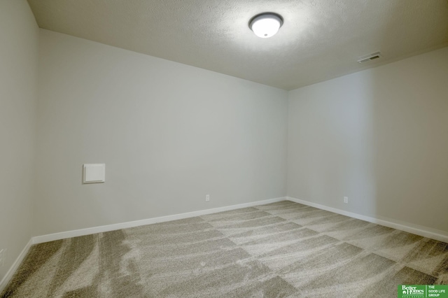 10110 Laramie St, Papillion, NE 68046 - carpeted spare room featuring baseboards and a textured ceiling