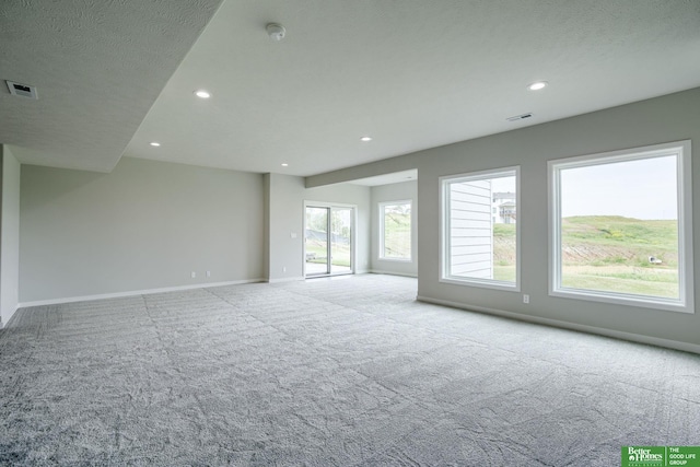 10110 Laramie St, Papillion, NE 68046 - carpeted empty room with plenty of natural light, recessed lighting, and a smoke detector