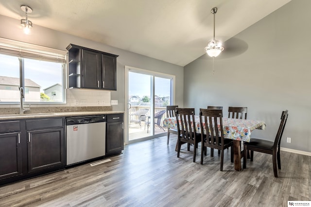 13913 Springview Dr, Papillion, NE 68133 - kitchen featuring dishwasher, light wood-style flooring, lofted ceiling, ceiling fan, and decorative backsplash