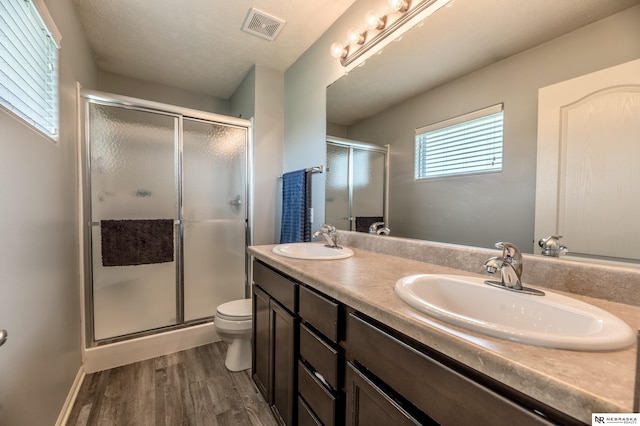 13913 Springview Dr, Papillion, NE 68133 - full bath with wood finished floors, double vanity, and a stall shower