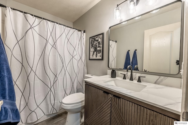 13913 Springview Dr, Papillion, NE 68133 - bathroom featuring vanity, wood finished floors, a textured ceiling, and a shower with curtain