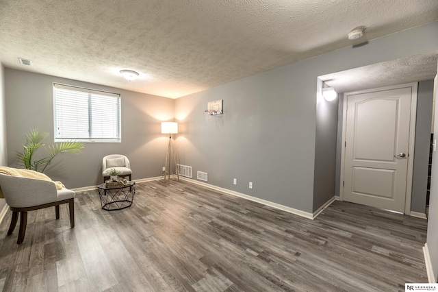 13913 Springview Dr, Papillion, NE 68133 - living area with wood finished floors and a textured ceiling