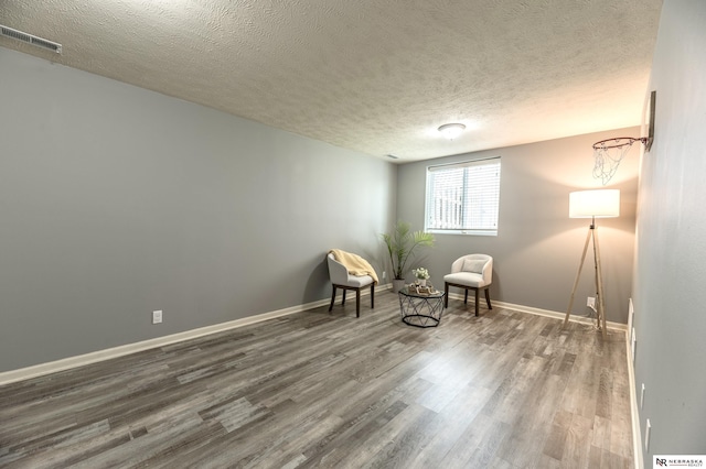 13913 Springview Dr, Papillion, NE 68133 - sitting room with wood finished floors and a textured ceiling