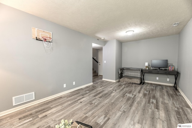 13913 Springview Dr, Papillion, NE 68133 - living area with wood finished floors, stairs, and a textured ceiling