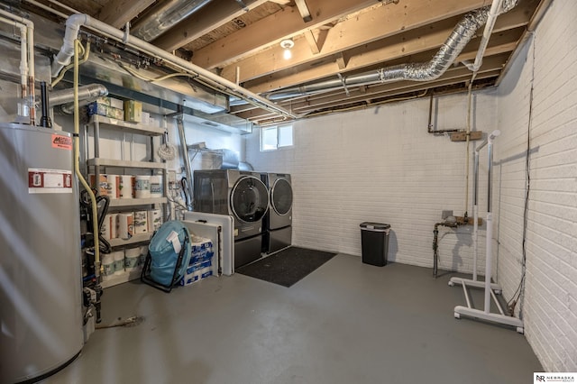 13913 Springview Dr, Papillion, NE 68133 - basement featuring washer and dryer, gas water heater, and brick wall