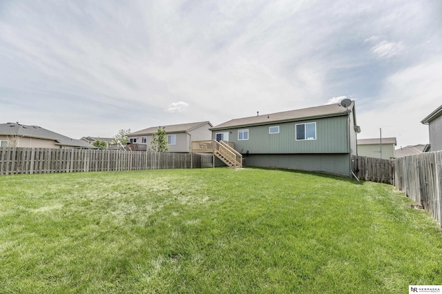 13913 Springview Dr, Papillion, NE 68133 - back of property featuring a fenced backyard and stairs