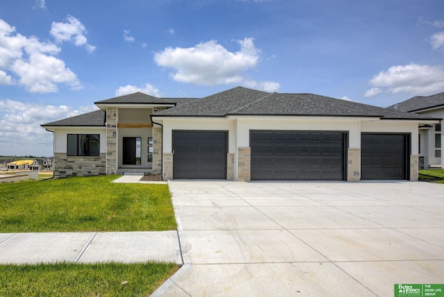 5620 N 212th St, Elkhorn, NE 68022 - prairie-style home featuring an attached garage, driveway, a front lawn, stucco siding, and a shingled roof