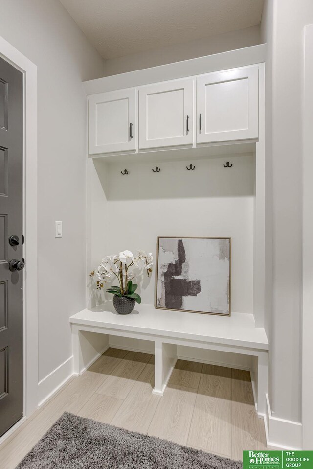 5620 N 212th St, Elkhorn, NE 68022 - mudroom featuring baseboards and wood finished floors